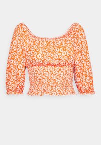 Blusa floreale arancione con maniche a sbuffo, vita smock e scollatura quadrata. Presenta un motivo di margherite bianche su tutta la superficie. Tessuto morbido e leggero.