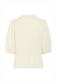 Blusa color crema realizzata in tessuto strutturato, con un sottile motivo a scacchi, maniche a sbuffo corte e scollatura tonda.