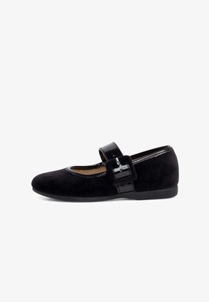 Black suede Mary Jane shoe featuring a patent leather strap and buckle, rounded toe, and cushioned insole. Flat rubber sole for comfort.