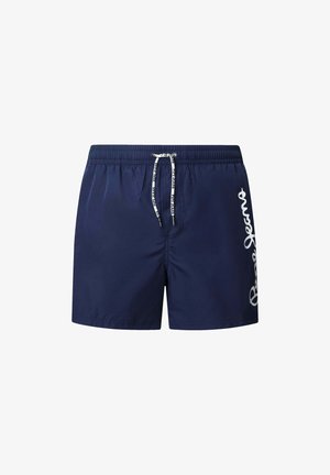 Tumesinised ujumispüksid, mis on valmistatud kergest kangast, elastse vöökoha ja paelaga ning millel on külje peal valge brändi logo.