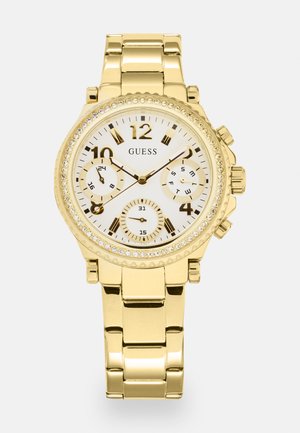 Gold-tone chronograph watch with a white dial, three sub-dials, gold hour markers, and crystal accents around the bezel. Metal bracelet.