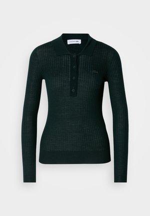 Schwarzes, geripptes Poloshirt mit langen Ärmeln, Knopfverschluss, flachem Kragen und gesticktem Logo auf der Brust. Hergestellt aus einem strukturierten Stoff.
