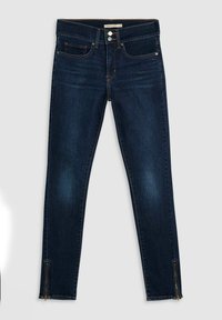 Ciemnoniebieskie skinny jeans wykonane z dżinsu, z kieszeniami z przodu, kontrastowym przeszyciem i zamkami na nogawkach dla dodatkowego efektu.