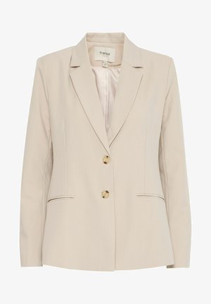Beige bleiseri, jossa on lovellinen kaulus, kaksi nappia ja sivutaskut. Valmistettu sileästä kankaasta, jossa on hienovaraisia ommeltuja koristeita.