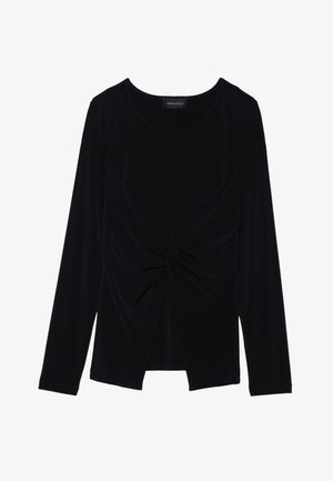 Must mustaheles pikkade varrukatega topp pehme ja veniva kangaga, millel on keeratud eesmine disain ja ümar kaelus. Sildil on kiri "ANNA FIELD."