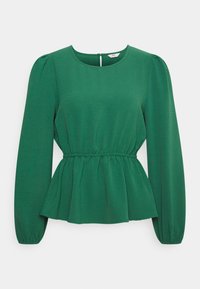 Top peplum verde con maniche lunghe, scollatura rotonda, vita arricciata e tessuto texturizzato. Apertura a chiave sul retro con chiusura a bottone.