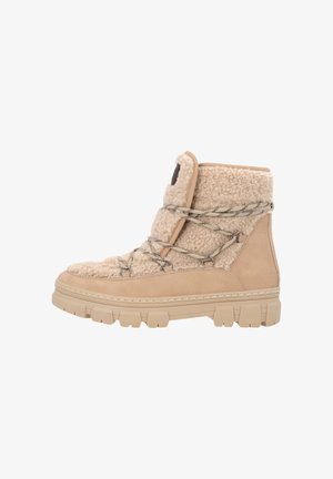 Beige hoge laarzen met een bovenwerk van imitatiebont met structuur, suède accenten en een dikke rubberen zool. Voorzien van decoratieve veters en een gevoerde kraag.