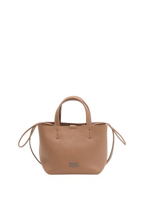Tan leather handbag with a textured finish, dual short handles, and adjustable long straps. Features a zip closure and logo detail on the front.
