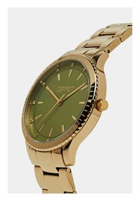 Goldfarbene Metalluhr mit einem matten grünen Zifferblatt, diamantähnlichen Markierungen und einer strukturierten Lünette. Verfügt über ein Gliederarmband-Design und eine Krone.
