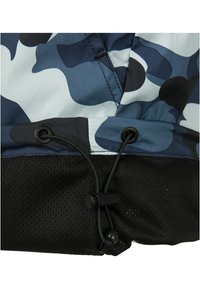 Blue camouflage jacket hem with black mesh fabric and adjustable black bungee cord secured by a plastic toggle.