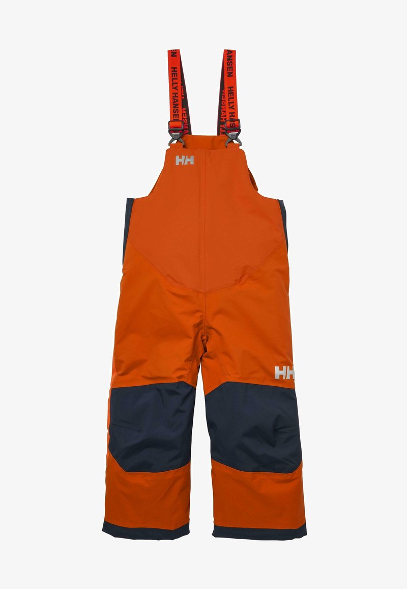 Orange och marinblå snöbyxor med justerbara hängslen, förstärkta knän och en silverlogotyp framtill. Designade för hållbarhet.