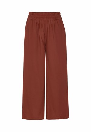 Hose mit weitem Bein in einfarbigem Rostton mit elastischem Bund, ohne sichtbare Taschen oder Muster, flach auf weißem Hintergrund dargestellt.