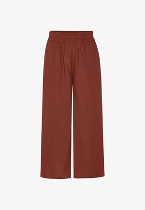 Hose mit weitem Bein in einfarbigem Rostton mit elastischem Bund, ohne sichtbare Taschen oder Muster, flach auf weißem Hintergrund dargestellt.