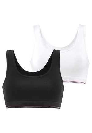 Zwei nahtlose Bralettes in Schwarz und Weiß, mit breiten Trägern, einem Rundhalsausschnitt und kontrastierenden gestreiften Bänderdetails am unteren Rand.