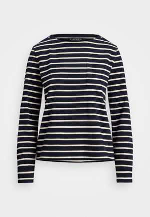 Bordo jaciņa ar garām piedurknēm un baltām horizontālām svītrām, apaļa kakla izgriezums un neliela krūšu kabata. Piedurknēs ir pogu akcenti uz pleca.