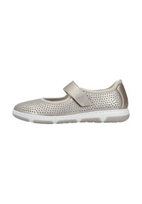 Light beige Mary Jane shoe with perforated upper, adjustable strap, and white rubber sole. Features a smooth texture and subtle design.