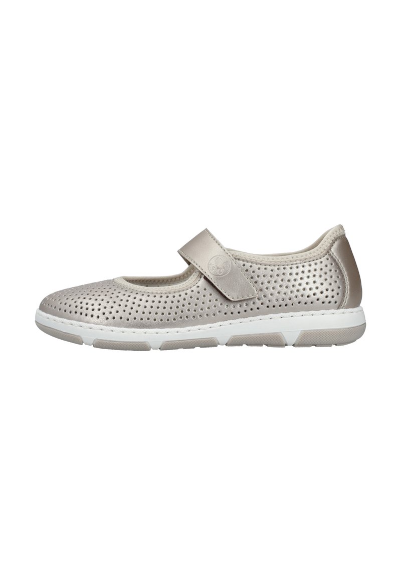 Light beige Mary Jane shoe with perforated upper, adjustable strap, and white rubber sole. Features a smooth texture and subtle design.
