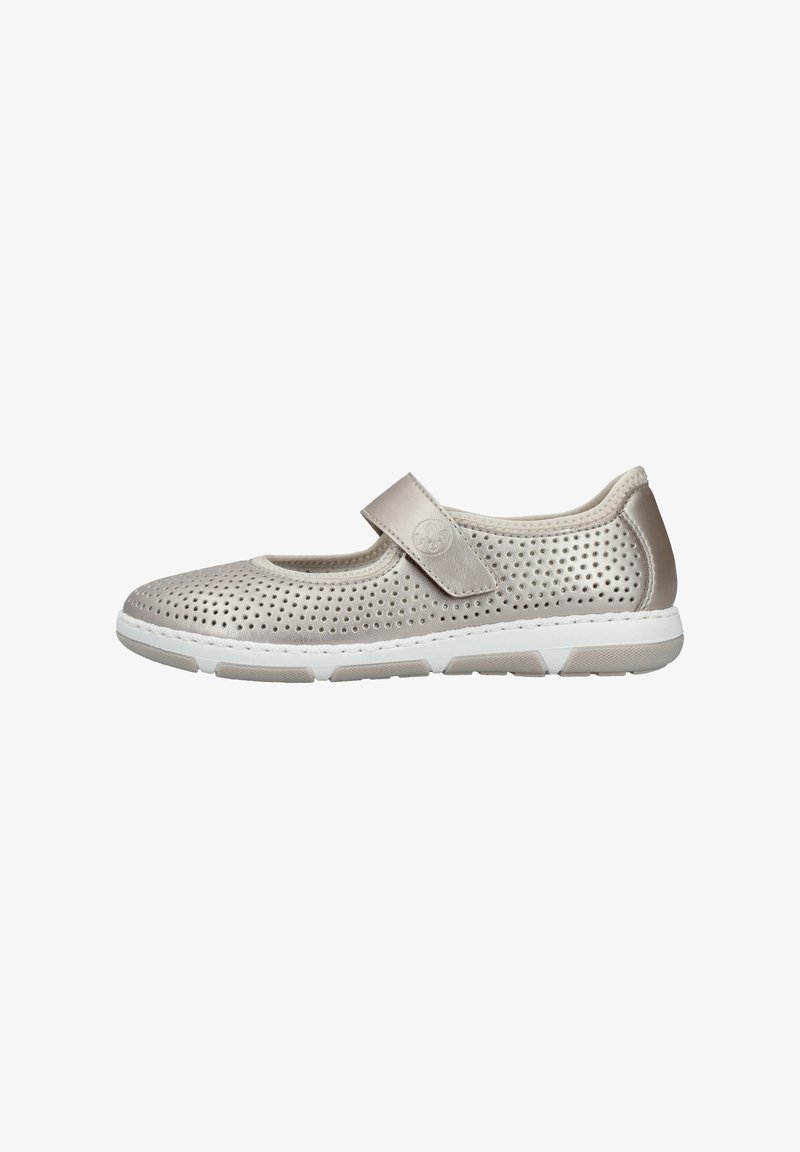 Light beige Mary Jane shoe with perforated upper, adjustable strap, and white rubber sole. Features a smooth texture and subtle design.
