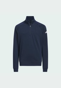 Sweatshirt bleu marine avec col zippé, manches raglan longues, poignets et ourlet côtelés. Présente un logo blanc sur l'épaule droite. Tissu doux.