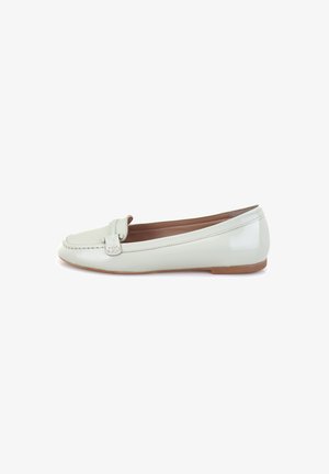 Light green patent leather flat shoe with a rounded toe, small decorative strap, and a flat brown sole. Smooth texture, minimalist design.