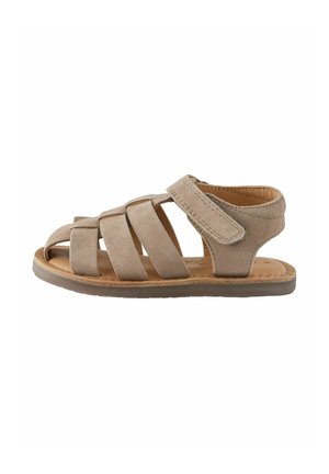 Beige toddler sandal with five suede straps and adjustable Velcro ankle closure, flat sole, and cushioned insole.