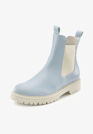 Light blue leather Chelsea boot with beige elastic side panels and chunky off-white sole, featuring pull tabs at front and back.