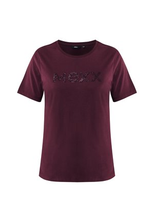 Camiseta corta de manga en color marrón con escote redondo. Presenta un logotipo texturizado "MEXX" en lentejuelas oscuras en el pecho. Tejido de algodón suave.