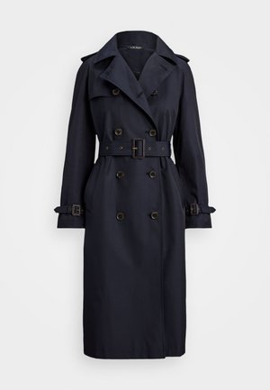 Jūras zilas krāsas lietussargs ar diviem pogu slēgumiem, jostu viduklī, lielām atlokām, plecu epauletēm un ar cilpiņām. Gluda auduma struktūra.