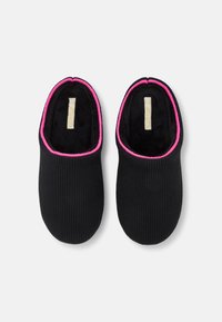 Black knitted slippers with a textured exterior and soft black interior, featuring a vibrant pink trim around the opening.