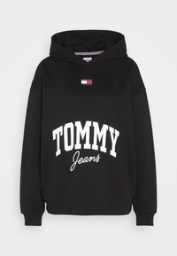 Felpa nera in cotone con tasca a marsupio frontale. Presenta il testo bianco "TOMMY Jeans" e una piccola patch con logo sul petto.