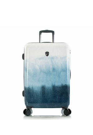 Koffer met telescopische handgreep, vier zwenkwielen en een verloopontwerp van wit naar donkerblauw.