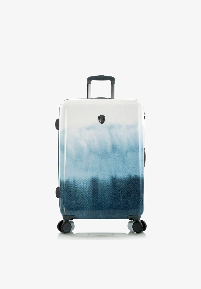 Valise avec poignée télescopique, quatre roues pivotantes et design en dégradé passant du blanc au bleu foncé.