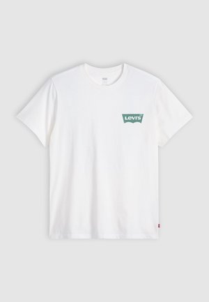 White short-sleeve Levi's T-shirt with green logo on left chest, crew neckline, and small red tag on left side seam.