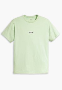 T-shirt en coton vert clair avec un col rond et des manches courtes, arborant un petit logo noir "LEVI'S" sur la poitrine.