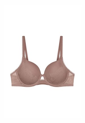 Biustonosz w jasnobrązowym kolorze, z koronkowym wykończeniem i miękkimi miseczkami, ozdobiony wzorami kwiatowymi i centralnym wycięciem. Regulowane ramiączka poprawiają dopasowanie i wsparcie.