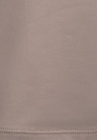 Light mauve fabric with a textured surface. Features a smooth, woven design with visible stitching along the edge; uniform color throughout.