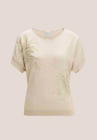 Beige gebreide trui met korte mouwen, voorzien van groene sprankelende bladvormen aan de voorkant. Geribbelde zoom op de taille. Ronde halslijn.