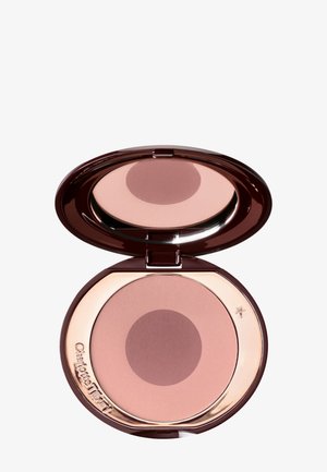 Poudre compacte de maquillage avec un design bicolore rose, logée dans un contenant rond marron foncé et miroir.