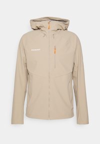 Veste softshell à capuche Mammut beige avec fermeture éclair avant et poche poitrine zippée avec tirettes orange.