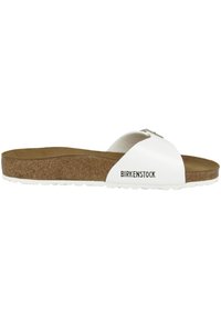 Infradito Birkenstock bianche con soletta in sughero, parte superiore morbida e testurizzata, e dettagli con logo sul lato. Design aperto e curvo per una vestibilità facile.