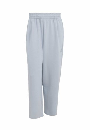 Pantaloni jogger azzurri in tessuto morbido con vita elastica, tasche laterali e un dettaglio logo discreto su una gamba.