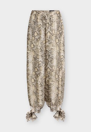 Loose pants with beige and brown snake print, elastic waistband, and tied cuffs at the ankles.