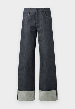 Mørkeblå denim-bukser har en vid-bein design, rå kant og kontrasterende let denim mansjetter med en subtil stikning.