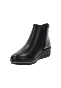 Bottine en cuir noir avec une finition lisse, fermeture éclair sur le côté et semelle compensée. Présente un bout légèrement arrondi et un accent texturé sur le talon.