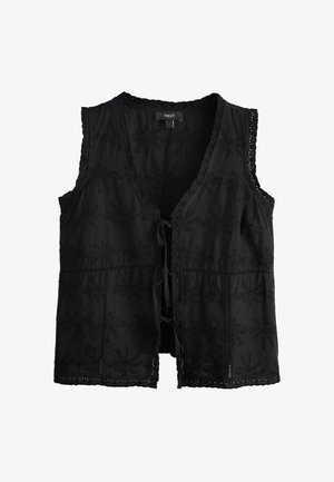 Czarna kamizelka bez rękawów z głębokim dekoltem w kształcie litery V, teksturowaną kwiatową haftowaną aplikacją, falowanym wykończeniem z koronki oraz zawiązywana z przodu.