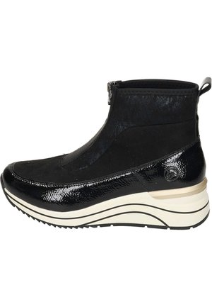 Bottines noires avec un dessus en vernis brillant et un tissu texturé mat. Comprend une fermeture éclair, un rembourrage et une semelle blanche à motifs.