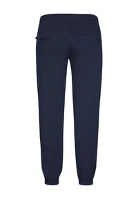 Marineblauwe sweatpants met een gladde textuur, elastische tailleband en twee achterzakken. Boorden bij de enkel voor een strakke pasvorm.