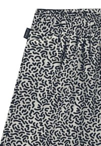 Pantaloni con vita elastica in tessuto bianco caratterizzati da un motivo astratto a squiggle nero. Include una cucitura laterale per una vestibilità ottimale.