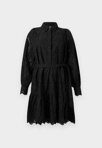 Svart kjole med knappellåsing foran, lange puffermene og belte i midjen. Har broderte detaljer og en bølget kant.