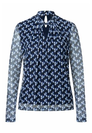 Blouse bleu marine à manches longues avec manches transparentes et petit motif floral, dotée d'un col avec ouverture en trou de serrure et fermeture par bouton.